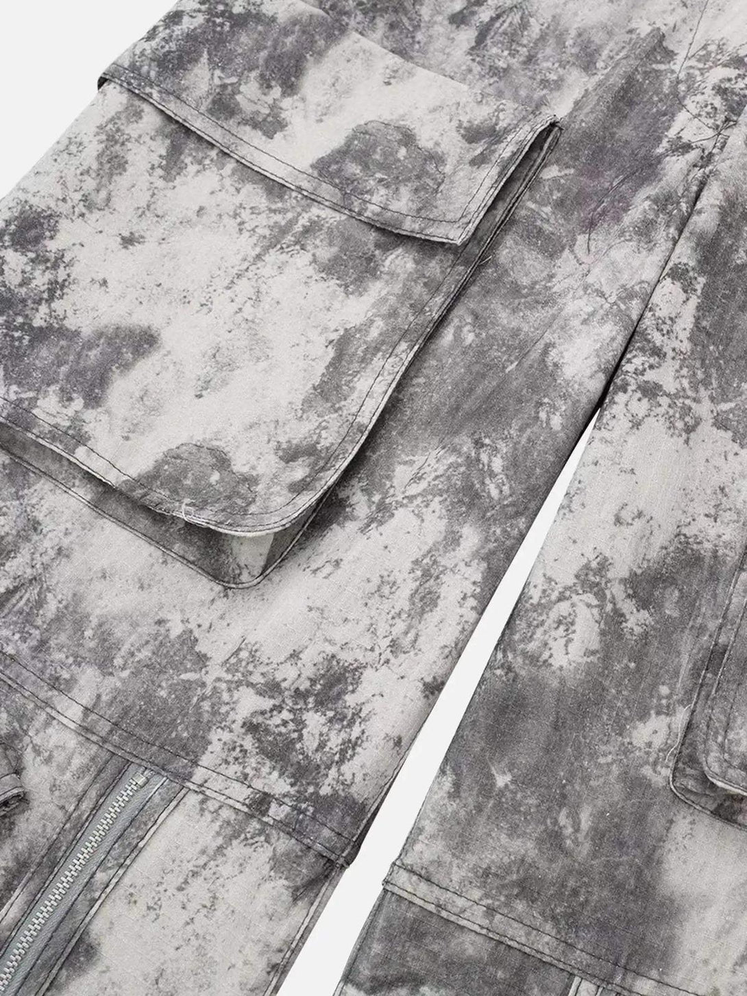 Texture and pattern showcased on TALISHKO's gray printed cargo pants with pocket details.