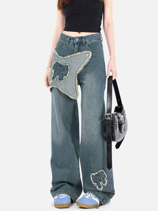 Model wearing TALISHKO fringe bow jeans with unique detailing and relaxed fit.