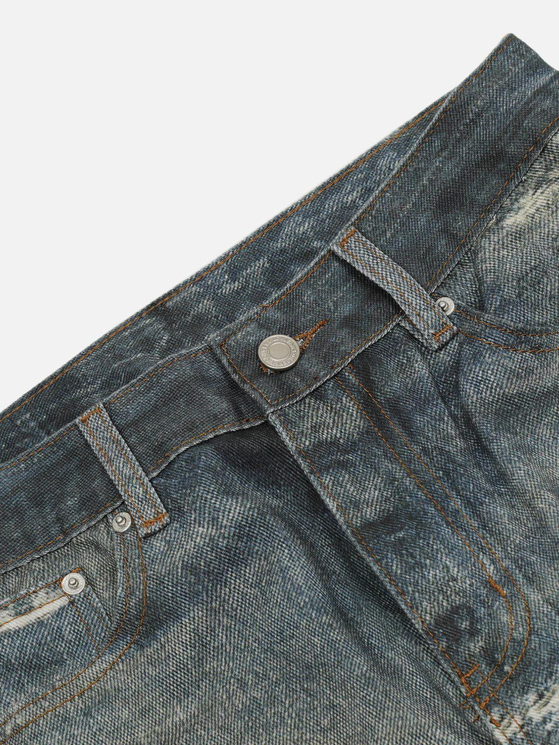 Detailed view of TALISHKO's fringe distressed jeans, showcasing intricate stitching and texture.