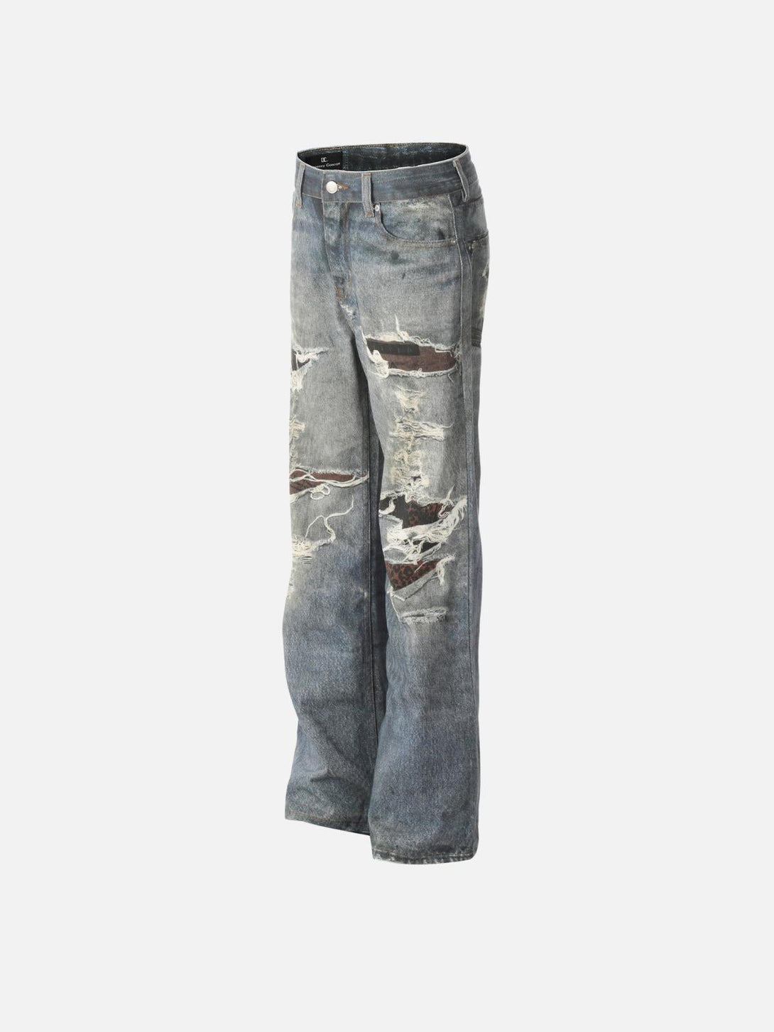 Side view of distressed print jeans by TALISHKO, featuring intricate fringe details.