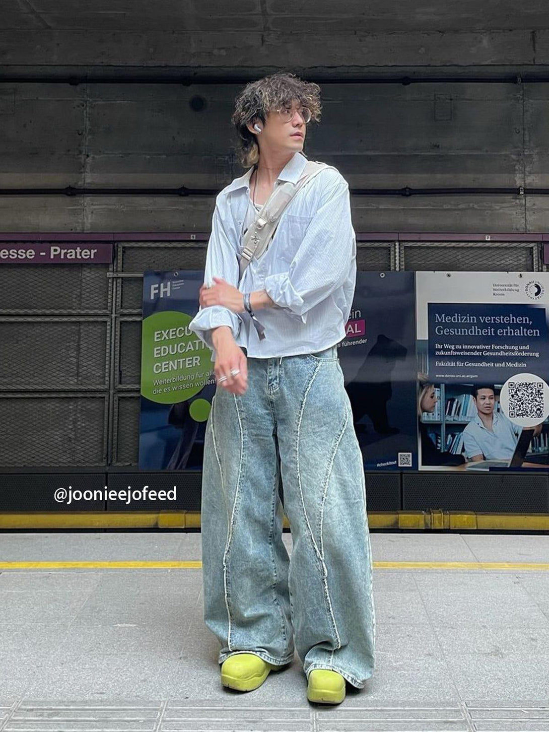 Model showcasing TALISHKO's fringe patchwork loose jeans with a light shirt and yellow shoes.