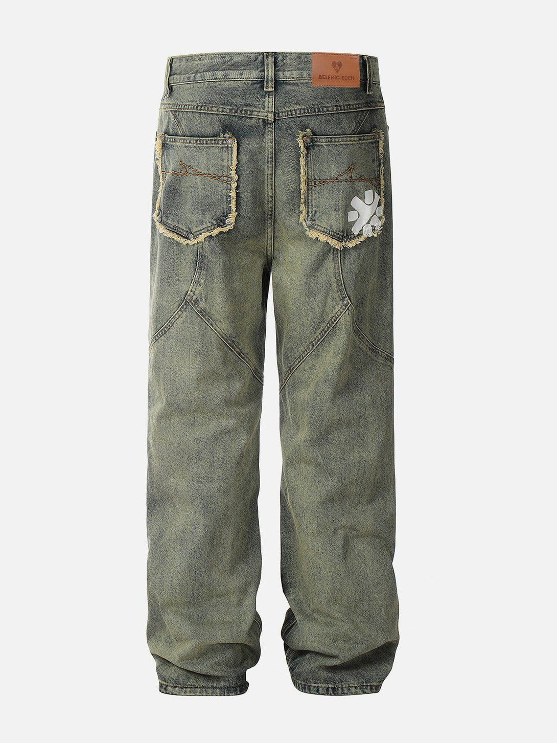 Back view of Fringe Pocket Jeans by TALISHKO, showcasing distressed pockets and unique stitching.