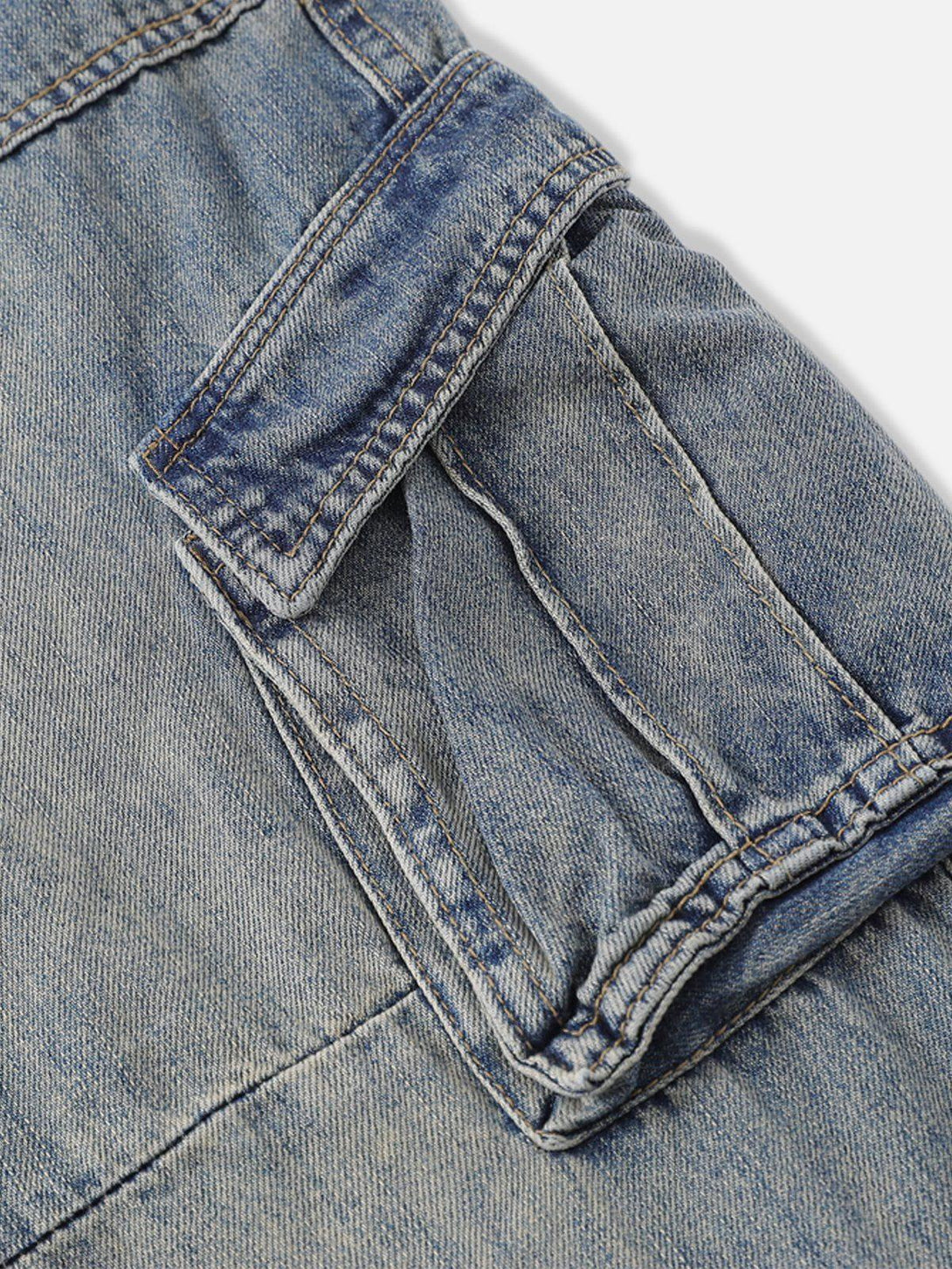 Intricate look at the pocket design on TALISHKO's washed multi-pocket jeans, showcasing denim texture.