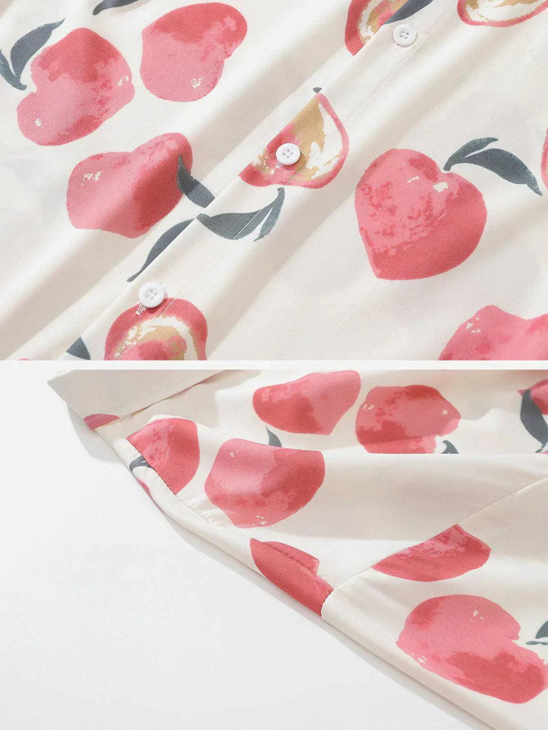 A detailed look at the fruit print fabric and buttons on a TALISHKO long-sleeved shirt.