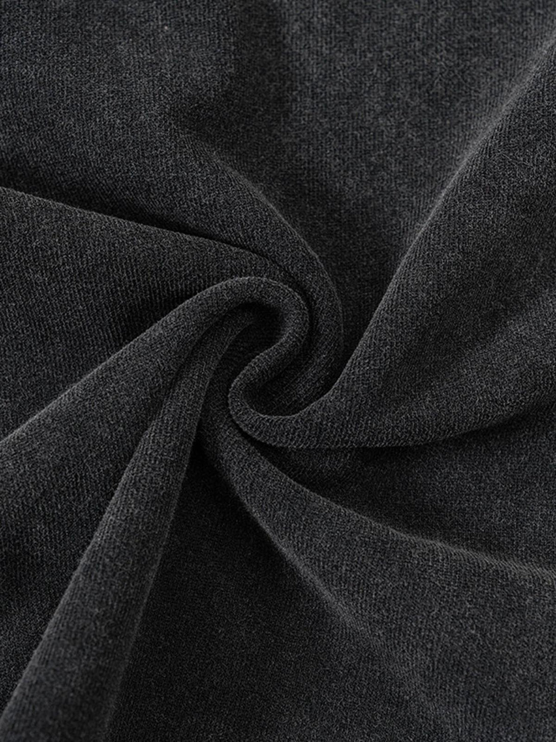 "Texture and pattern showcased on a TALISHKO T-shirt, highlighting its intricate fabric detail."