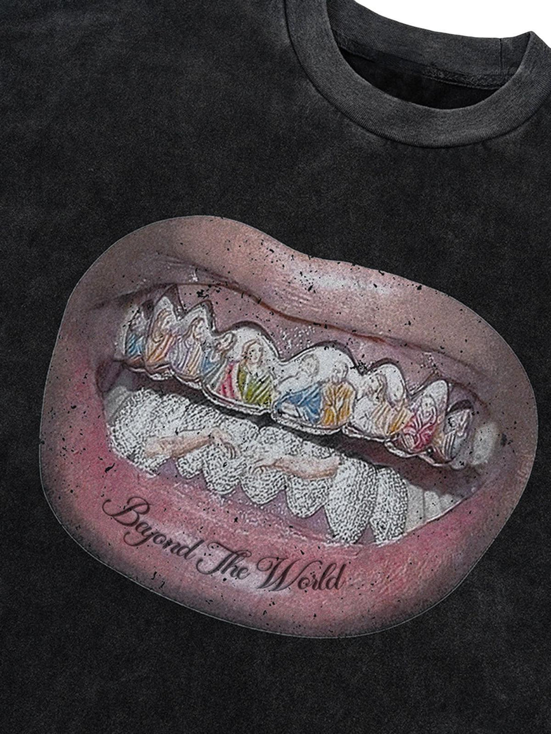 A close-up of a TALISHKO T-shirt featuring a detailed lips and diamond teeth graphic.