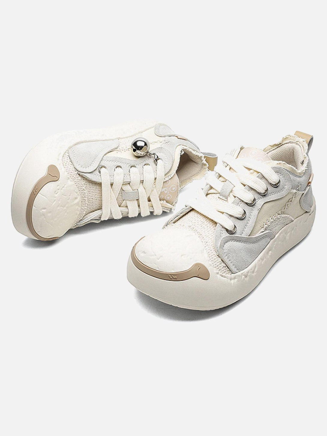 TALISHKO sneakers featuring leather splicing and a playful design, shown in a dynamic angle.