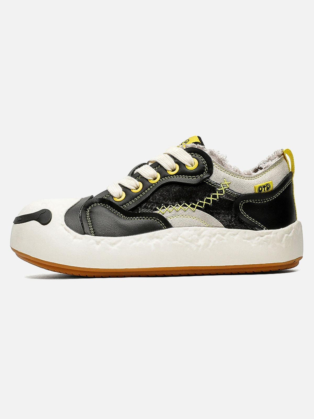TALISHKO sneakers with a playful big toe design and leather splicing, side view highlighted.