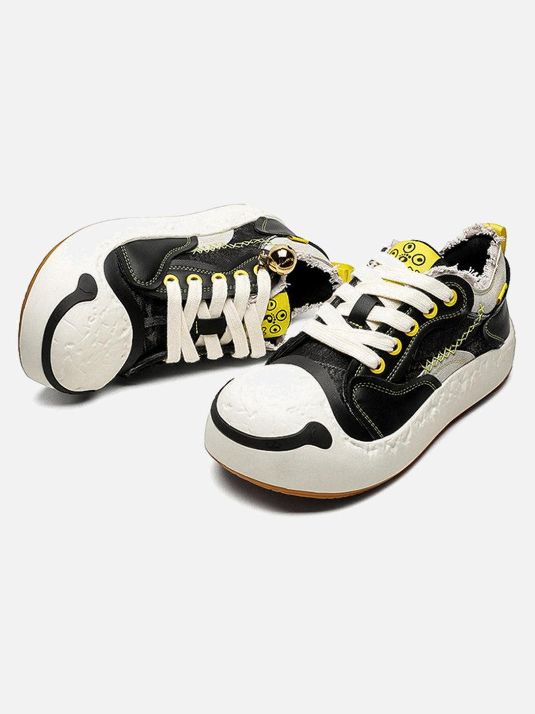 Playful TALISHKO sneakers featuring a unique design with black and white leather splicing.