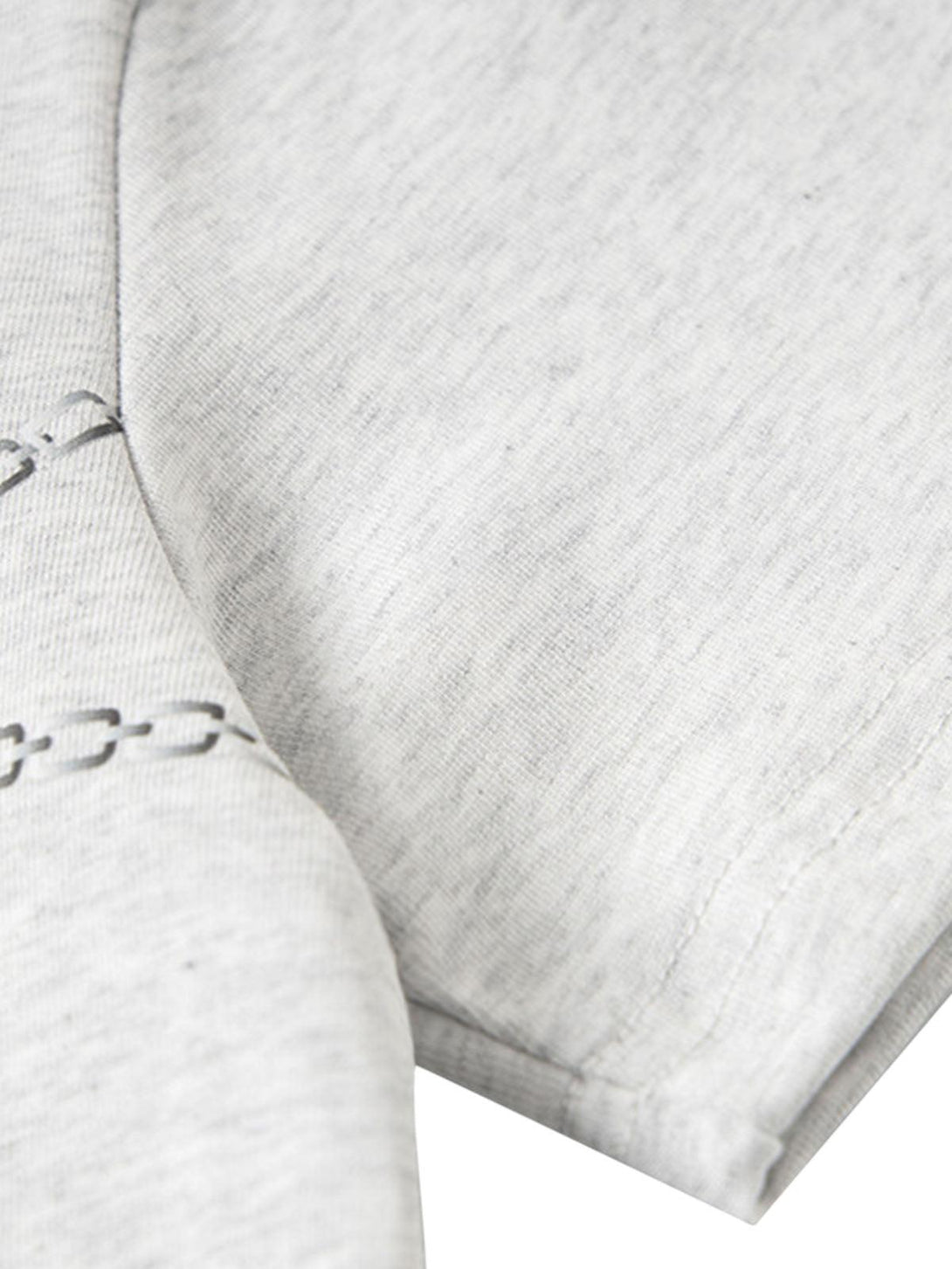 Detailed fabric and stitching of TALISHKO's cartoon print T-shirt in light gray.