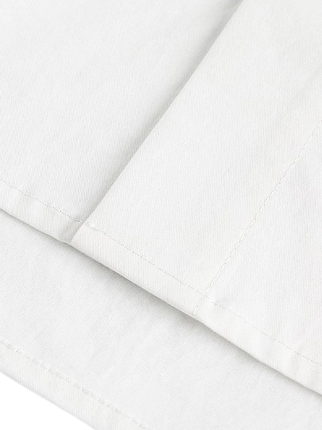 Detailed fabric and stitching of a white short sleeve shirt by TALISHKO, emphasizing quality.
