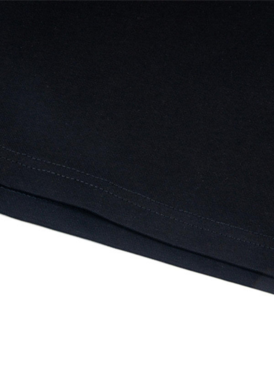 Detailed fabric and stitching of a black T-shirt by TALISHKO, highlighting quality craftsmanship.