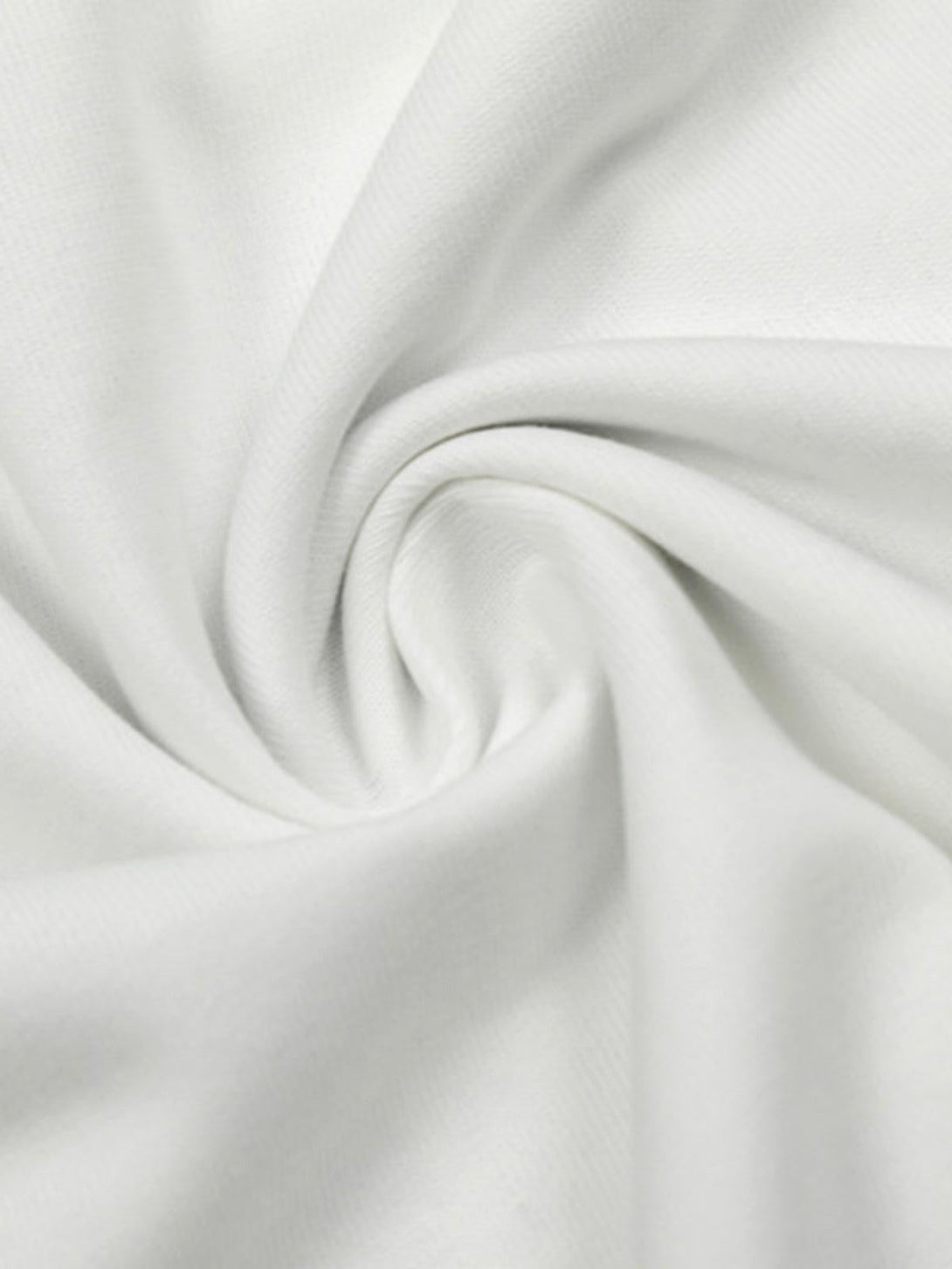 Intricate look at TALISHKO's white fabric texture, perfect for a relaxed and stylish vibe.