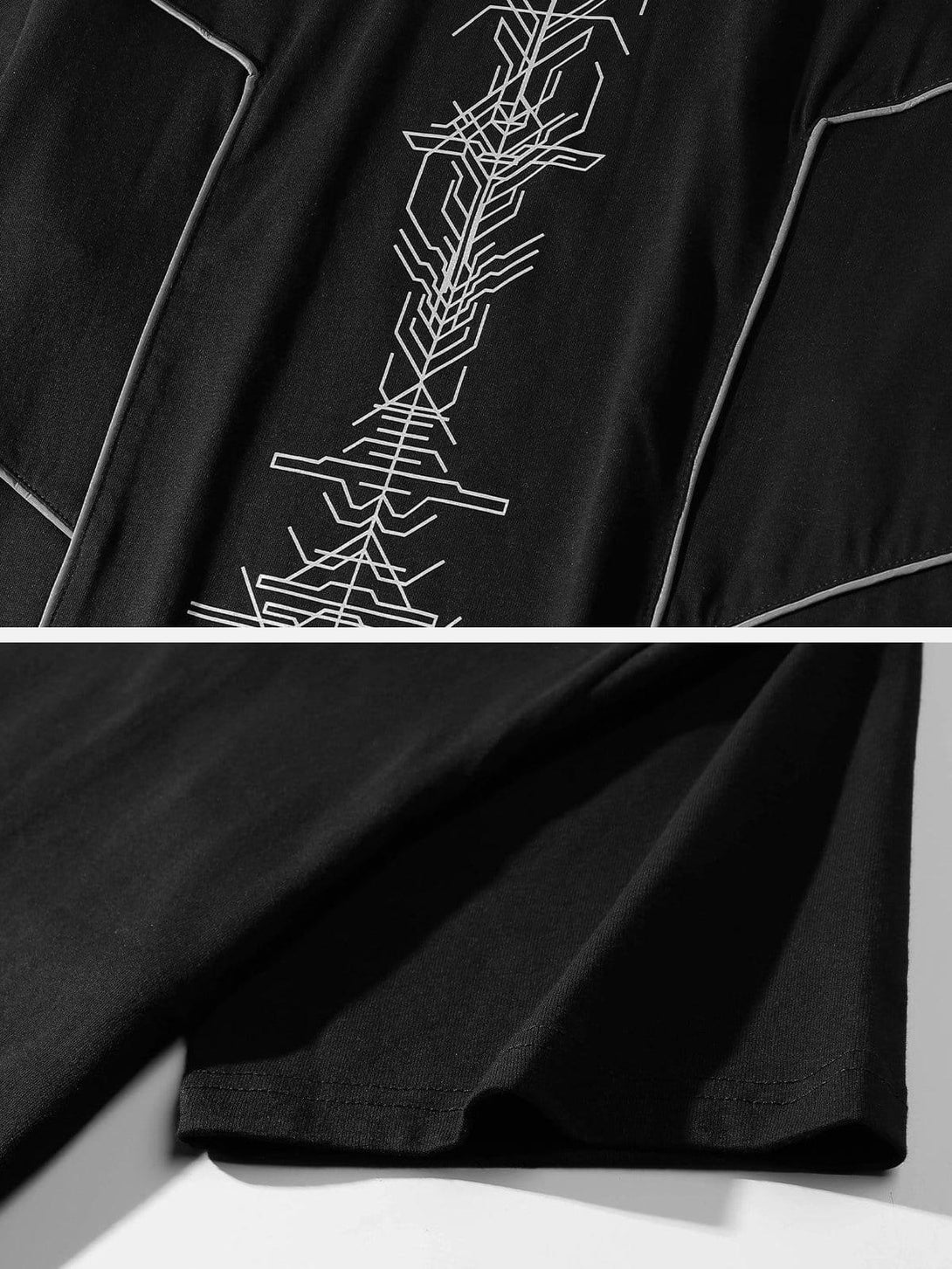 Detailed view of the black cotton tee's reflective geometric print by TALISHKO.