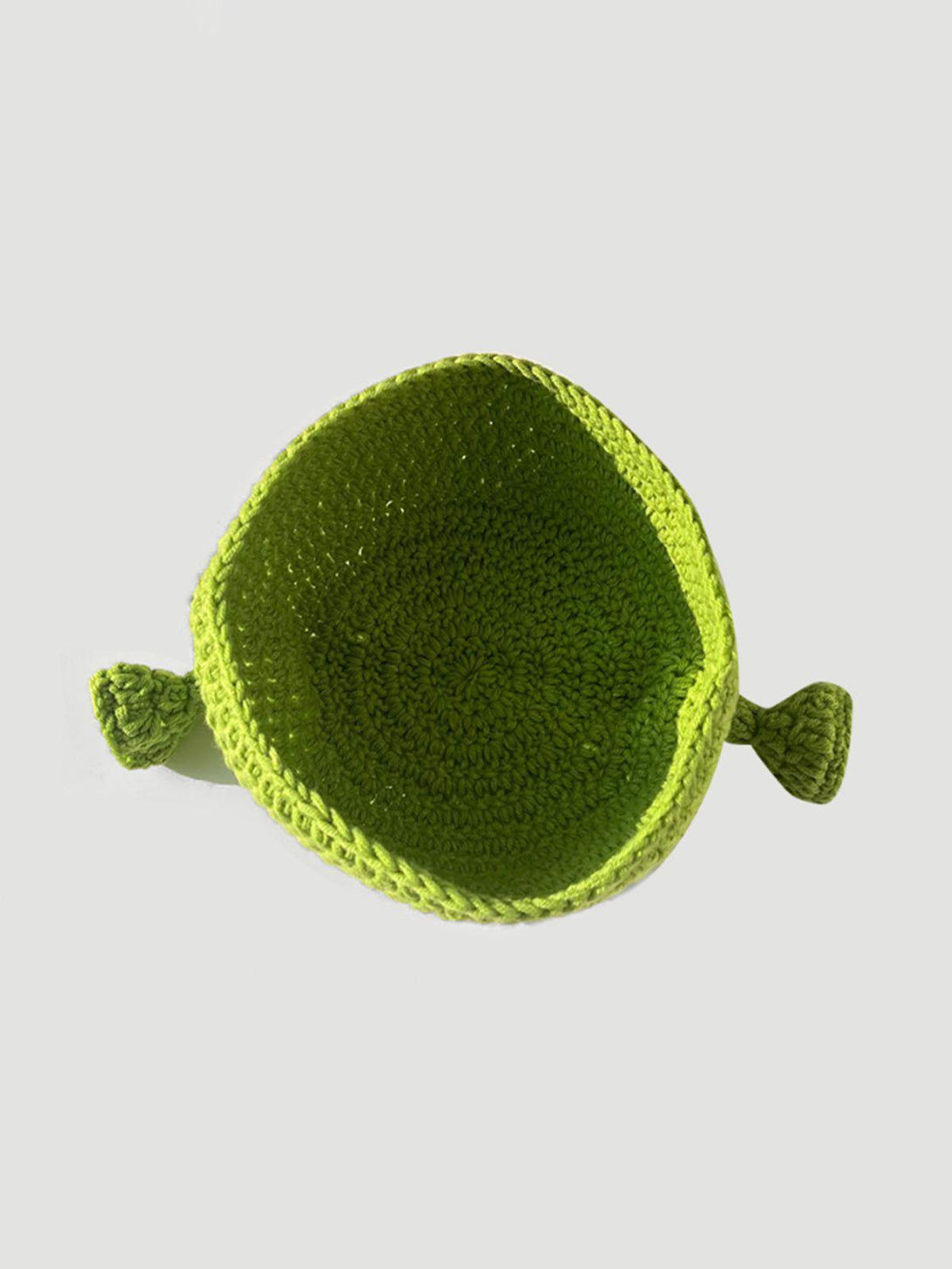 A top-down view of the playful green crochet Shrek beanie by TALISHKO, highlighting its unique design.