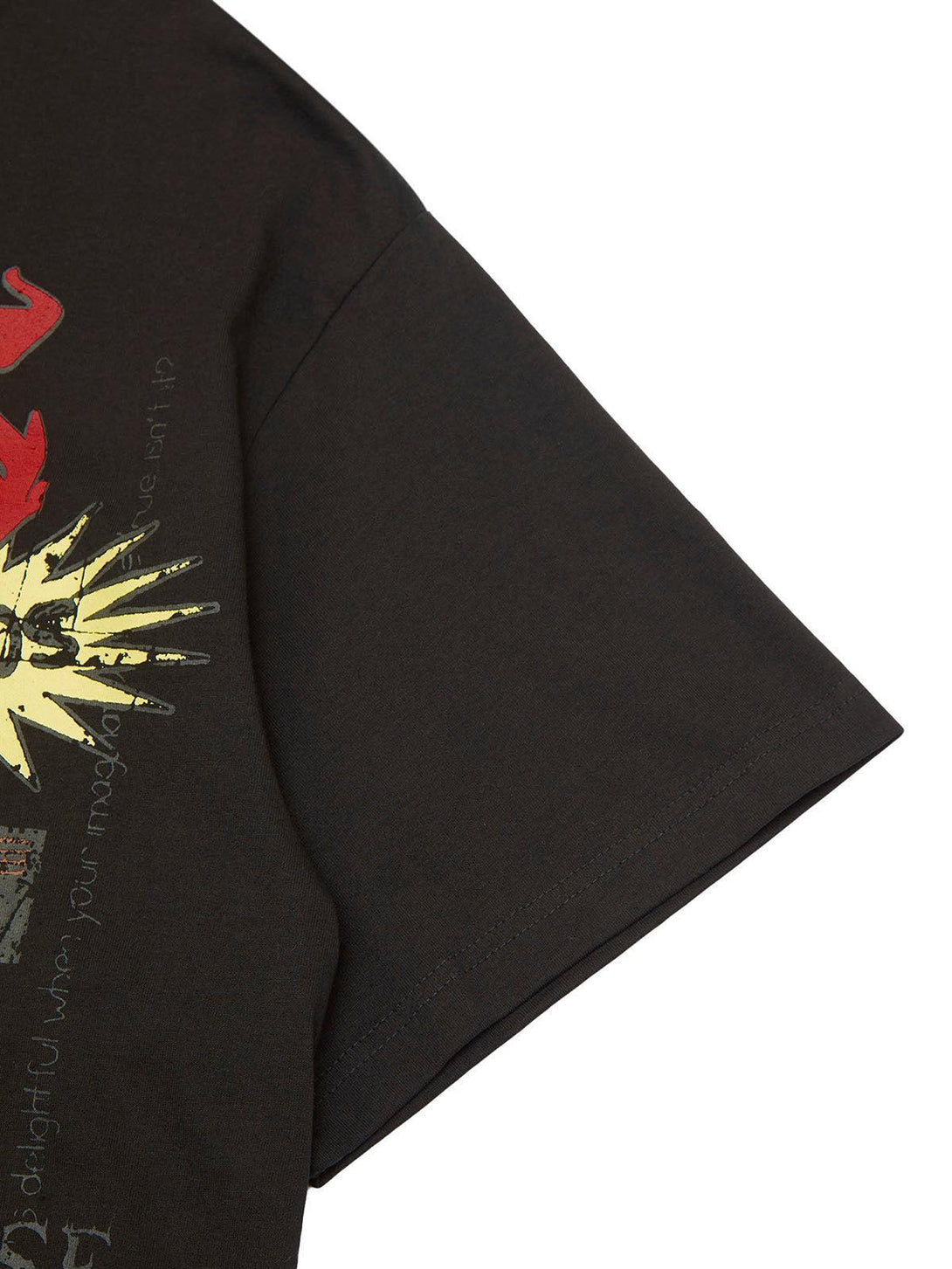A detailed look at the TALISHKO T-shirt sleeve featuring vibrant graffiti art on dark fabric.
