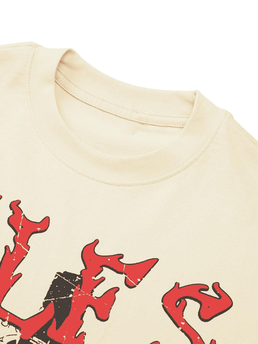 A close-up of the TALISHKO T-shirt showcasing bold red graffiti-style lettering on a light fabric.