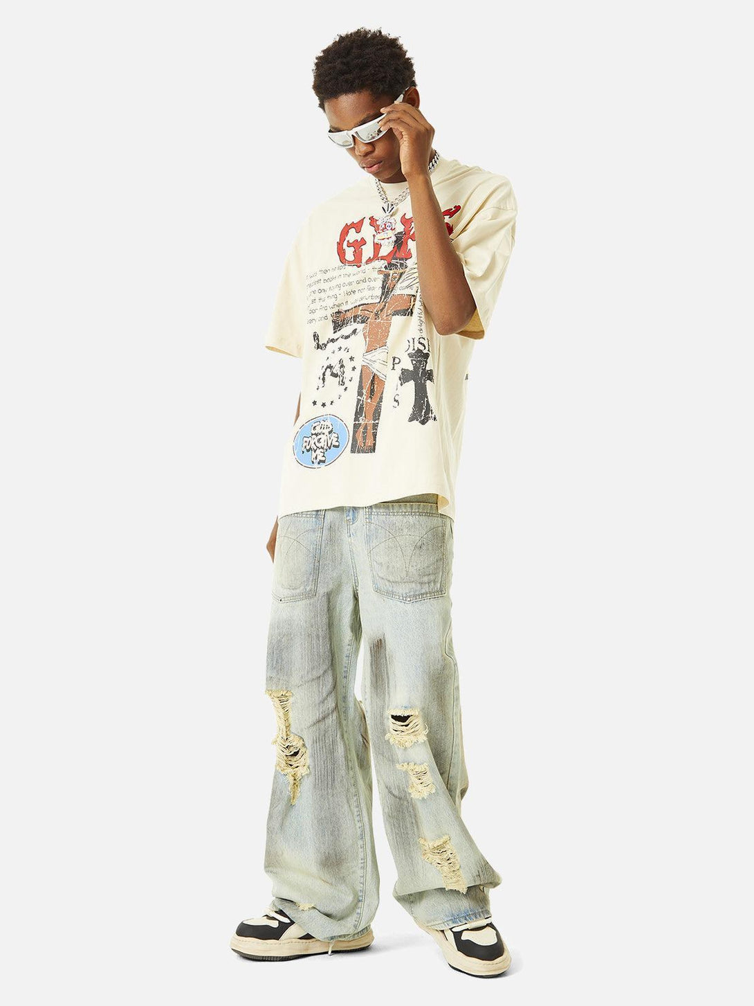 Model wearing a TALISHKO graphic T-shirt with street-style jeans, capturing urban cool.