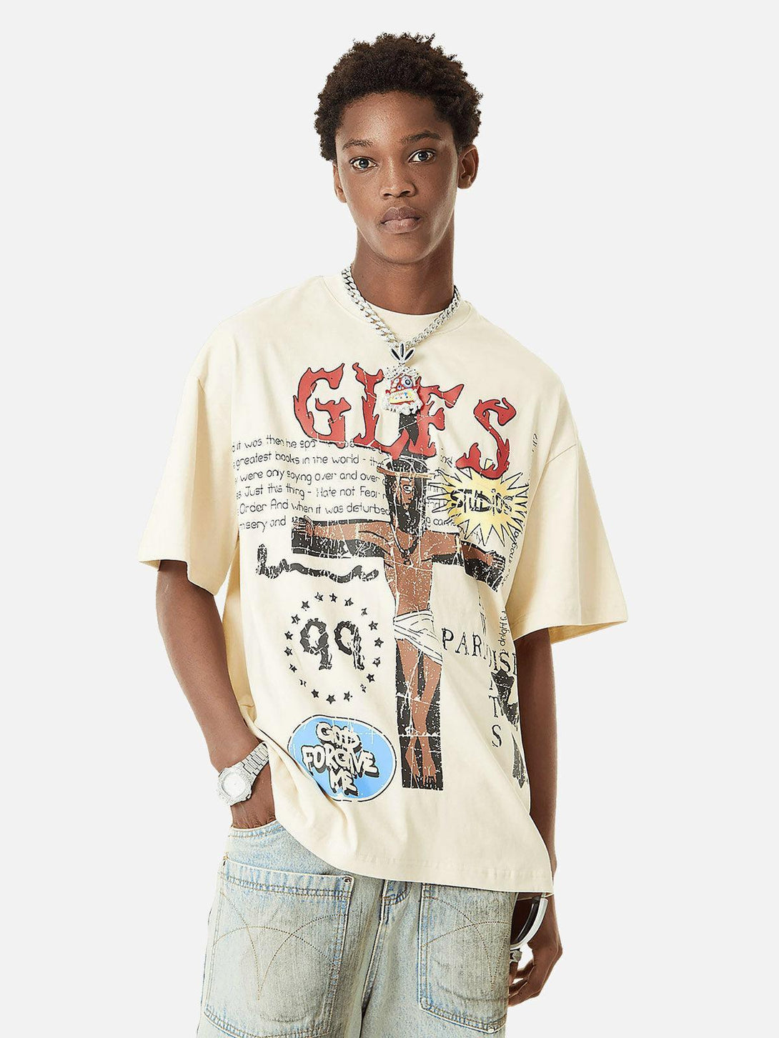 Model wearing a graphic T-shirt with bold graffiti art, styled casually by TALISHKO.