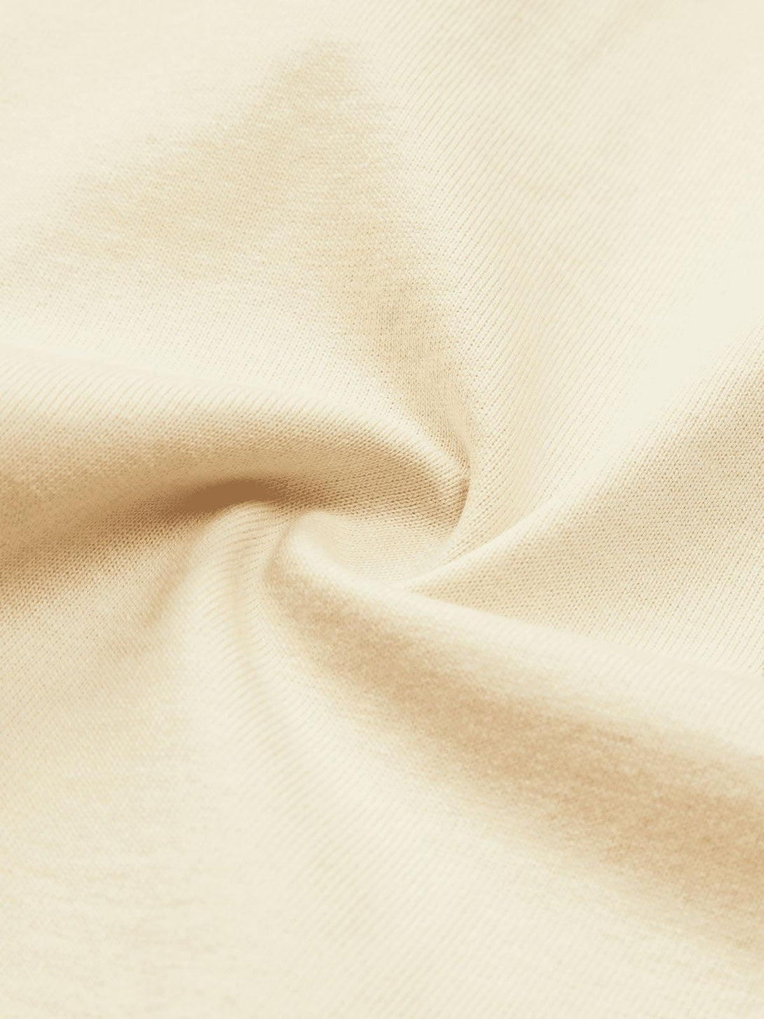 Zoomed-in texture of a light T-shirt fabric by TALISHKO, highlighting its soft detail.