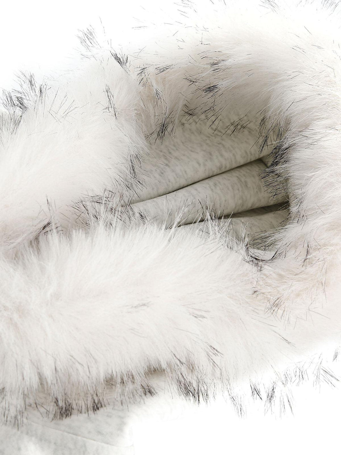 A detailed look at the plush fur collar of a TALISHKO cardigan, showcasing luxurious texture.
