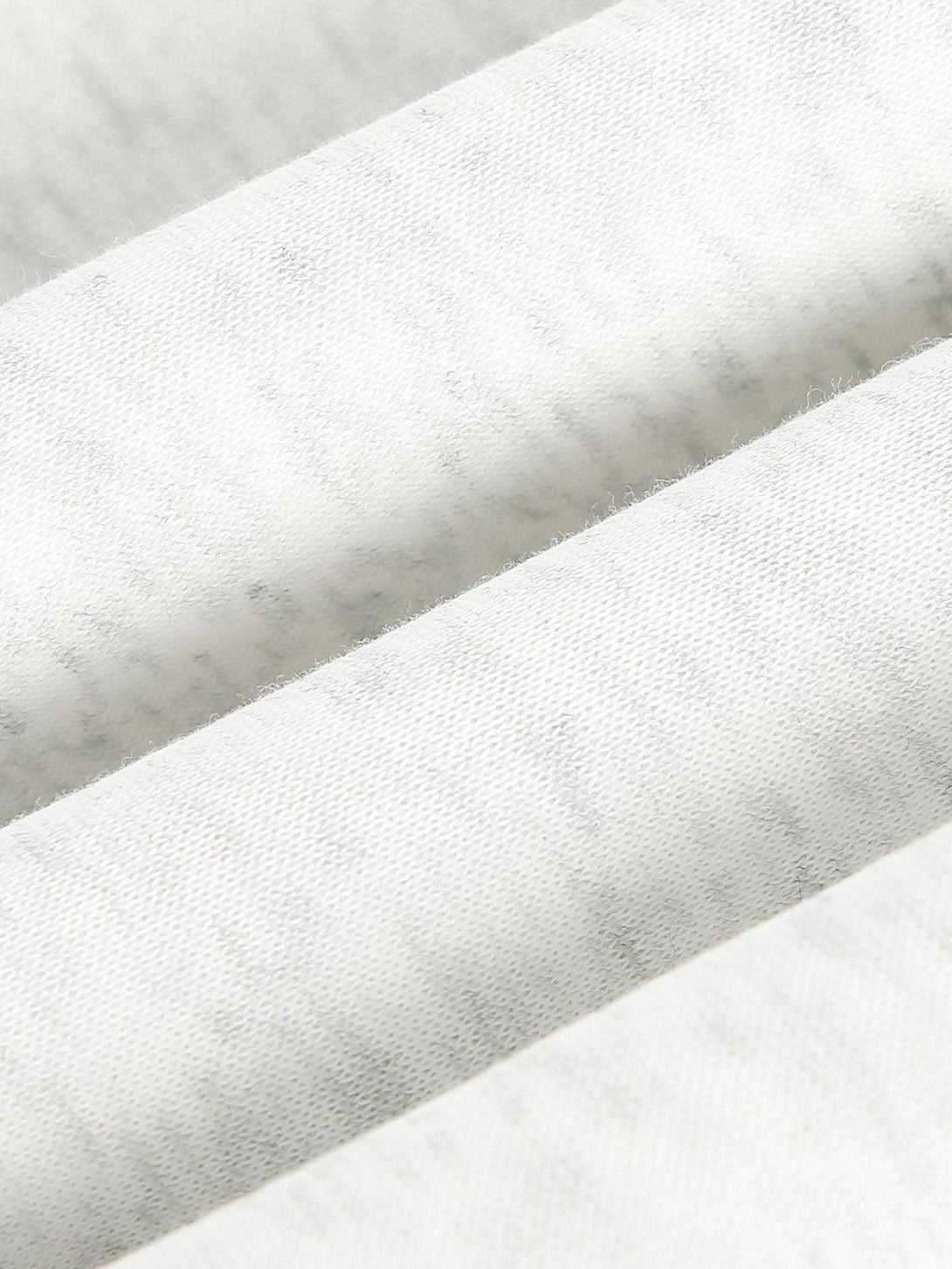 Detailed texture and fabric of a TALISHKO cardigan, showcasing intricate craftsmanship.