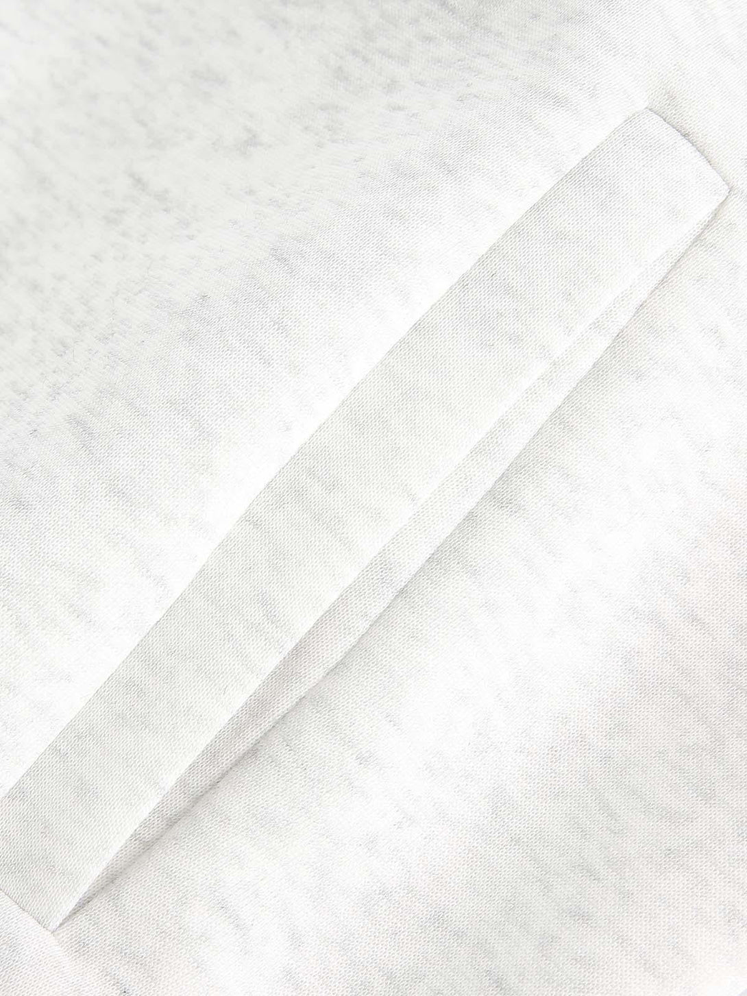 Detailed fabric and stitching of a TALISHKO cardigan, highlighting the intricate texture.