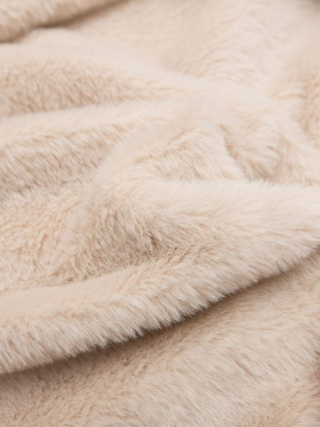 Texture and softness of the TALISHKO bomber jacket's fur lining, offering cozy comfort.