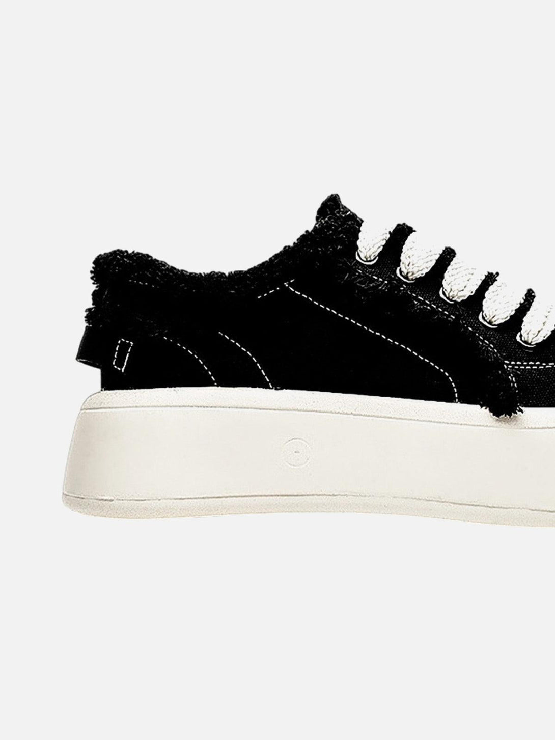 TALISHKO's fuzzy trim chunk shoe side view, highlighting the plush black texture and thick sole.