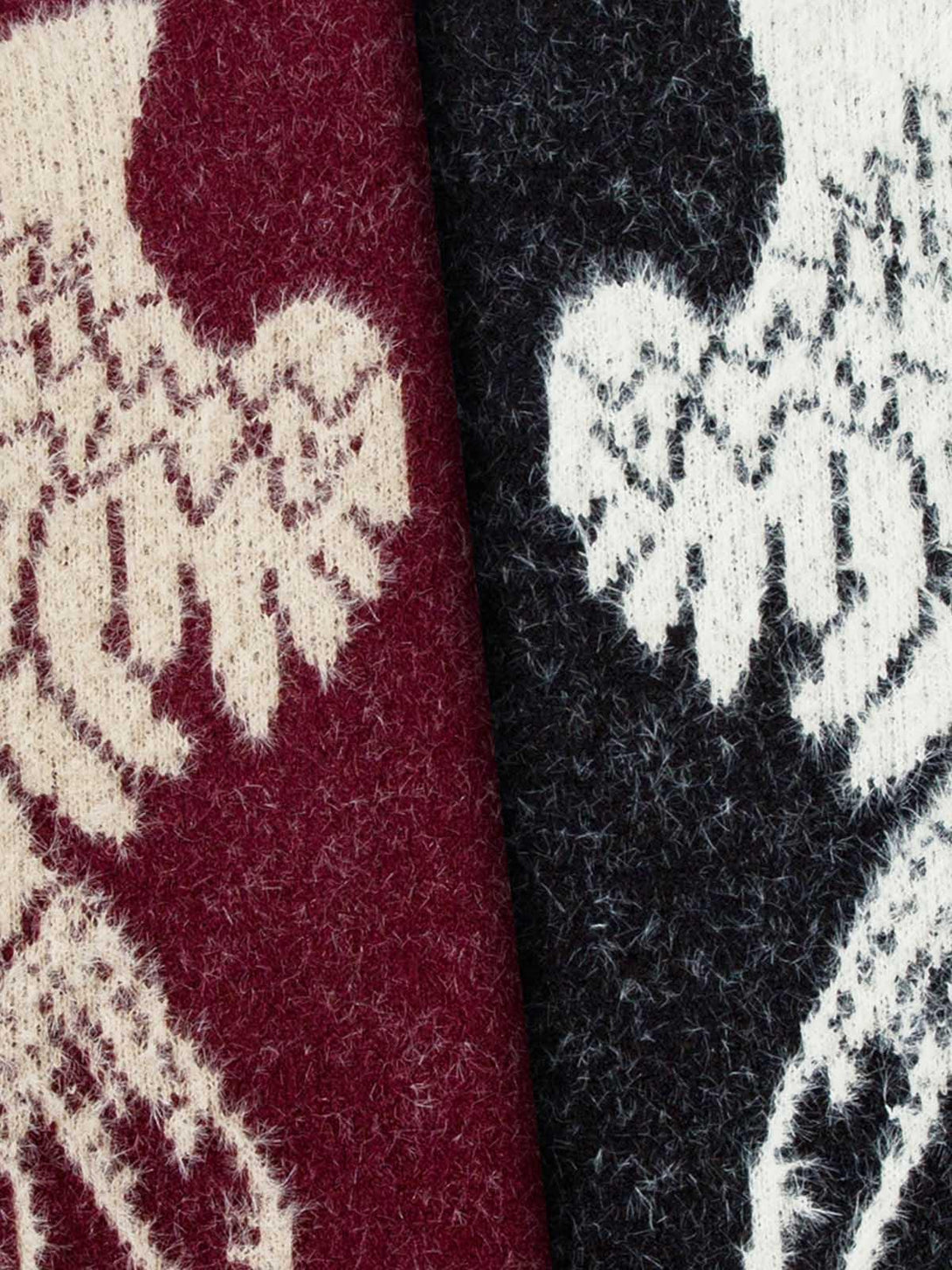 Intricate look at TALISHKO's fuzzy fabric showcasing angel wing patterns in black and maroon.