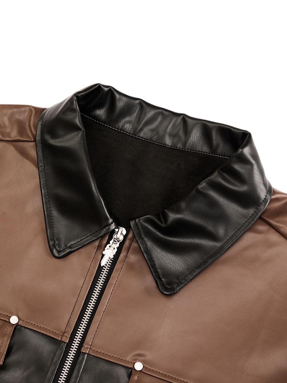 A detailed view of a patchwork leather shirt collar by TALISHKO, highlighting contrast textures.