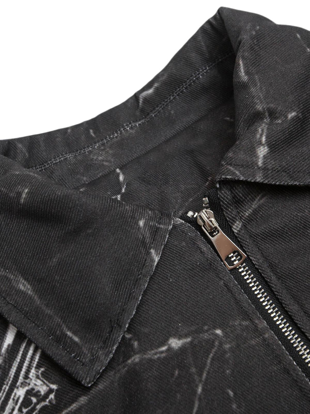 Focusing on the zipper and collar details of TALISHKO's gem-printed bomber jacket.