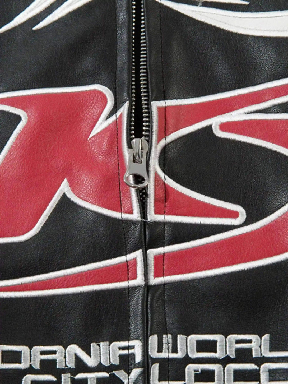 A detailed view of TALISHKO's jacket, showcasing the bold graphic and zipper design.