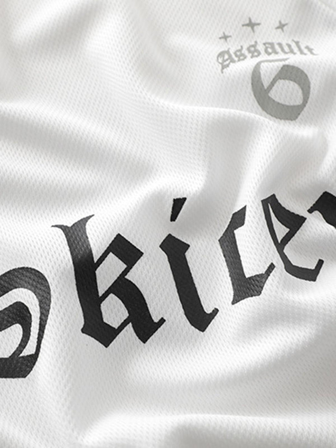 Zoomed-in texture of TALISHKO Gothic font jersey, highlighting fabric and detailed design.