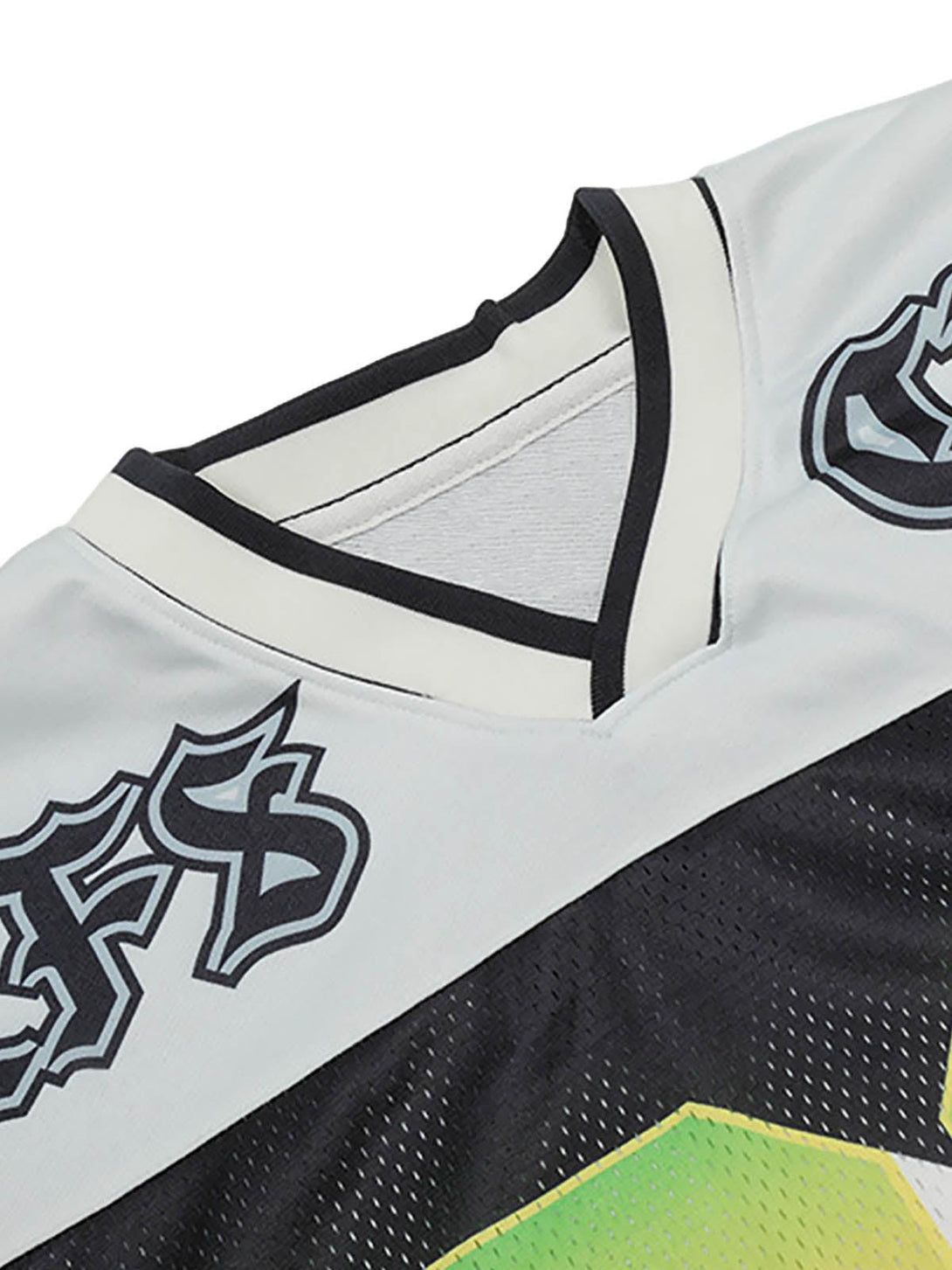 Focusing on the intricate embroidery and neckline detail of TALISHKO's Gothic-style jersey T-shirt.