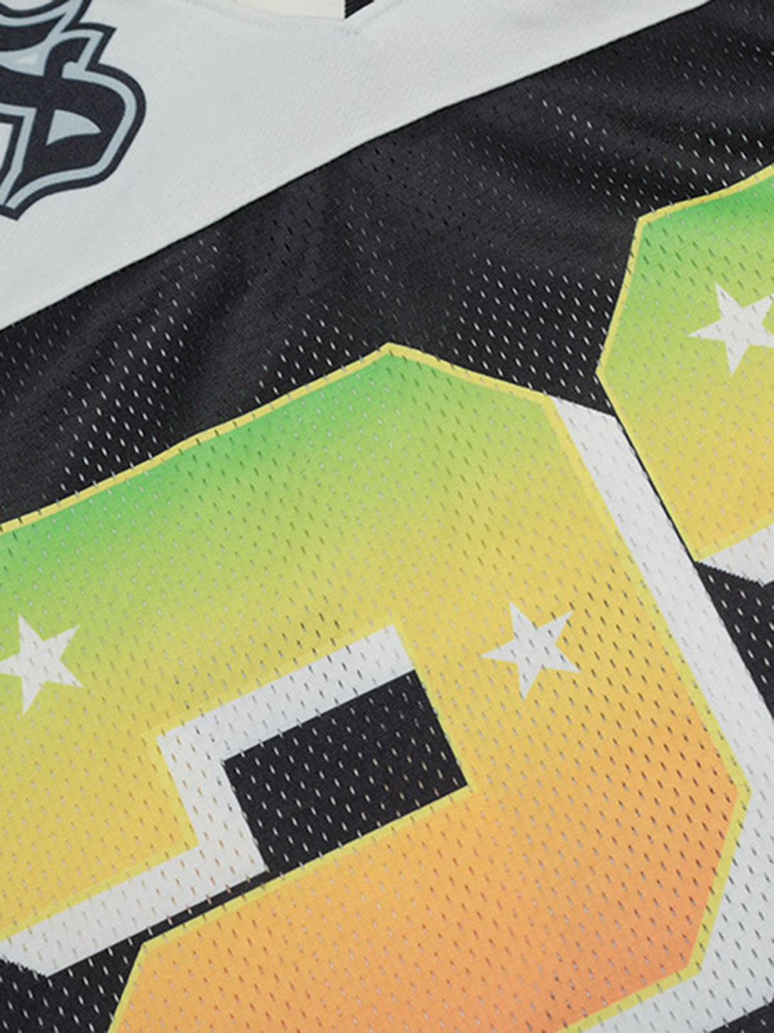 Zoomed-in texture of TALISHKO's Gothic-style jersey T-shirt showcasing vibrant gradient details.