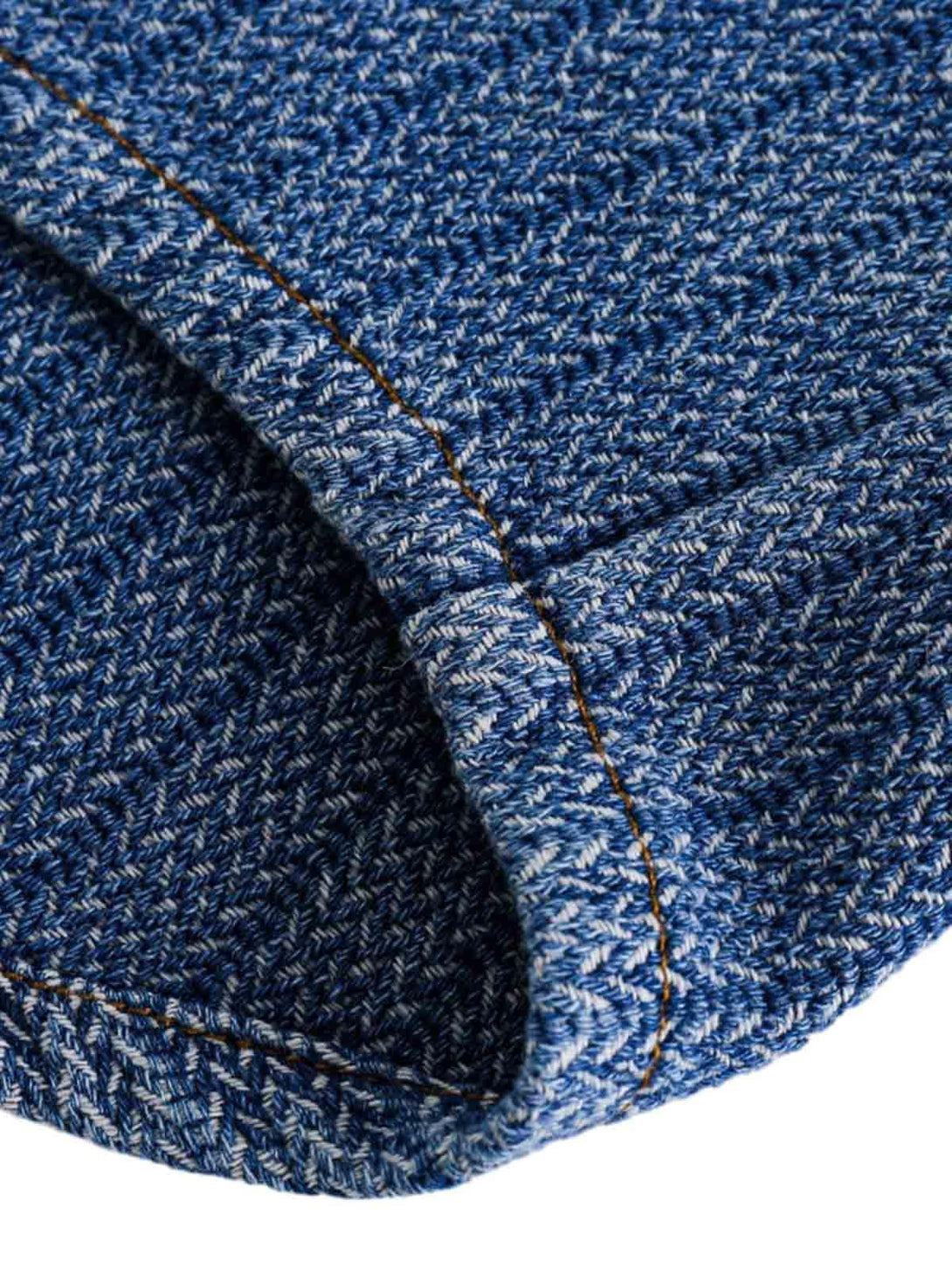 Detailed fabric and stitching of TALISHKO's gradient denim shirt, highlighting rich texture.