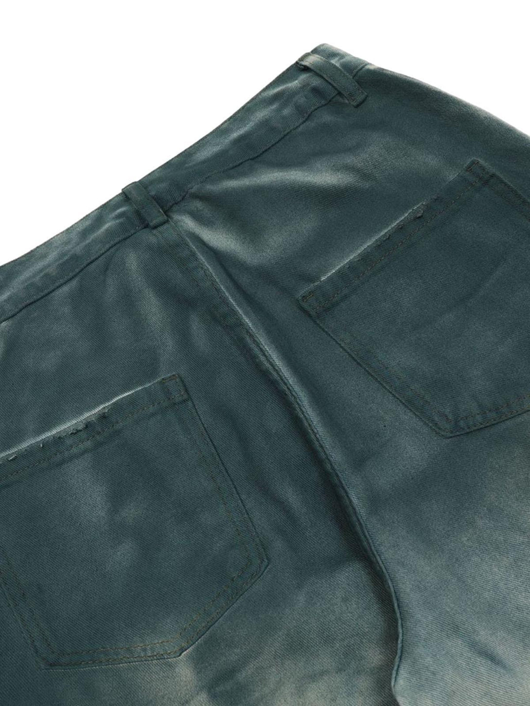 Back detail of TALISHKO cargo jeans, highlighting the gradient dip dye and pocket design.