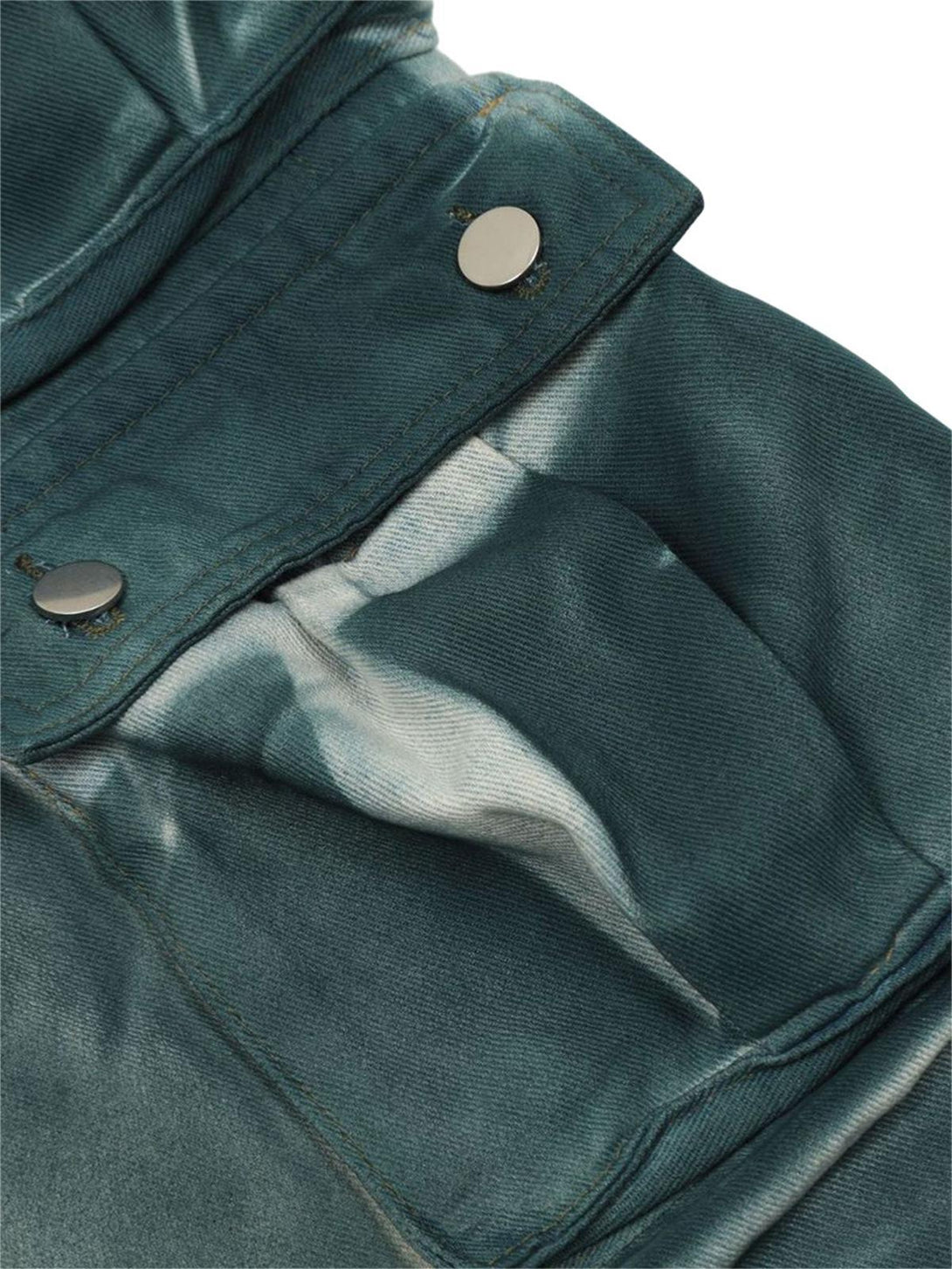 Intricate look at TALISHKO's gradient dip dye cargo jeans, focusing on textured fabric details.