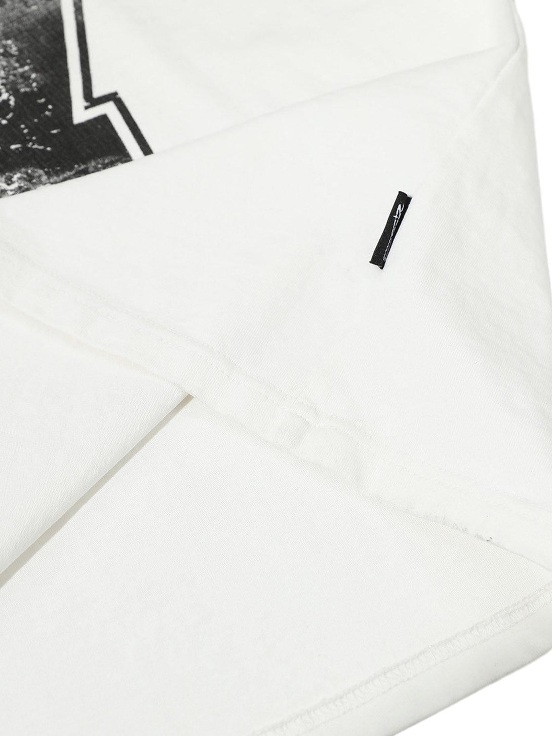 Intricate look at TALISHKO jersey t-shirt's stitching and fabric detail, showcasing quality design.