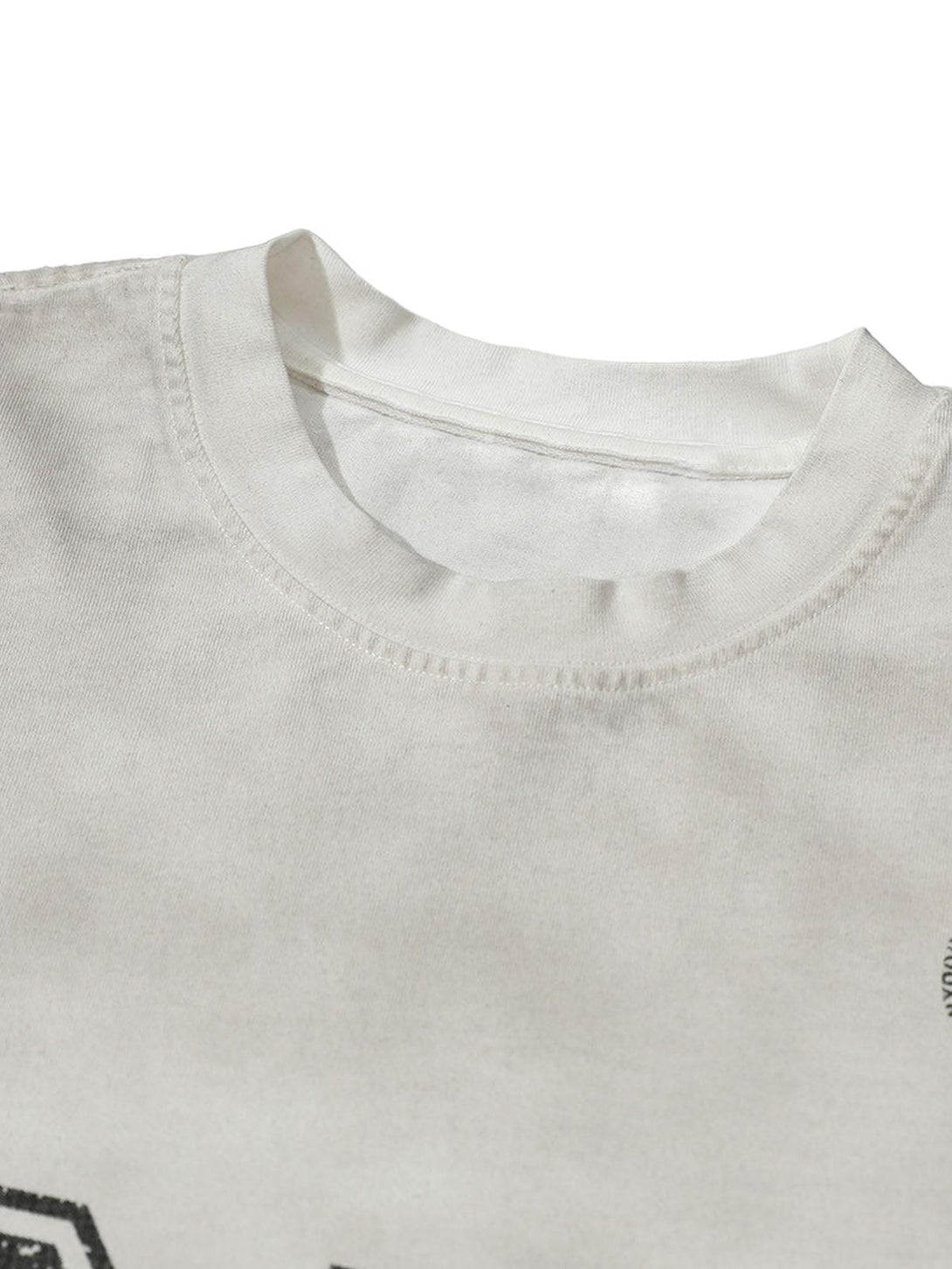A detailed view of the TALISHKO jersey t-shirt neckline, showcasing its soft fabric and stitching.