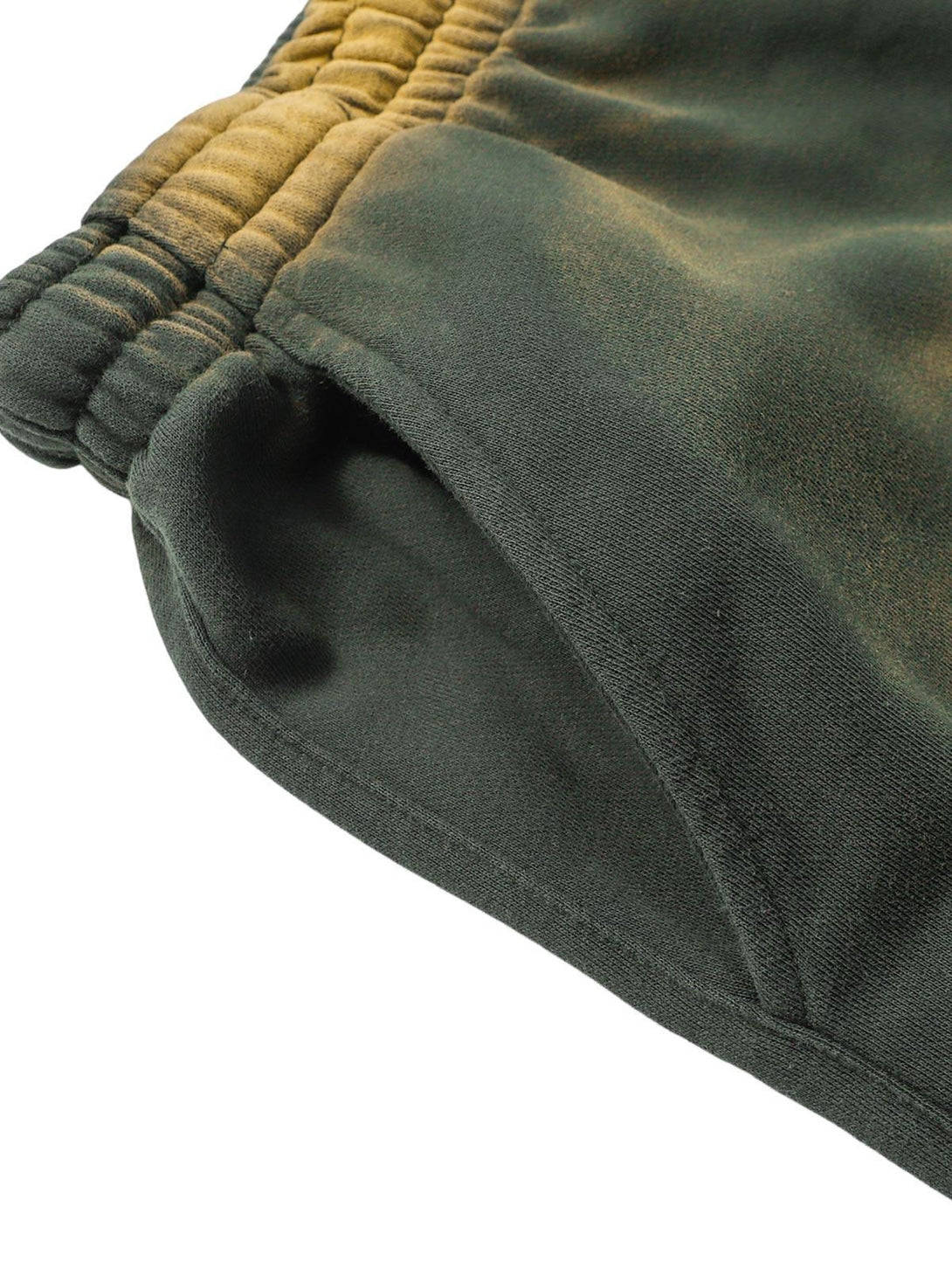Zoomed-in view of TALISHKO gradient drawstring shorts, highlighting the fabric texture.