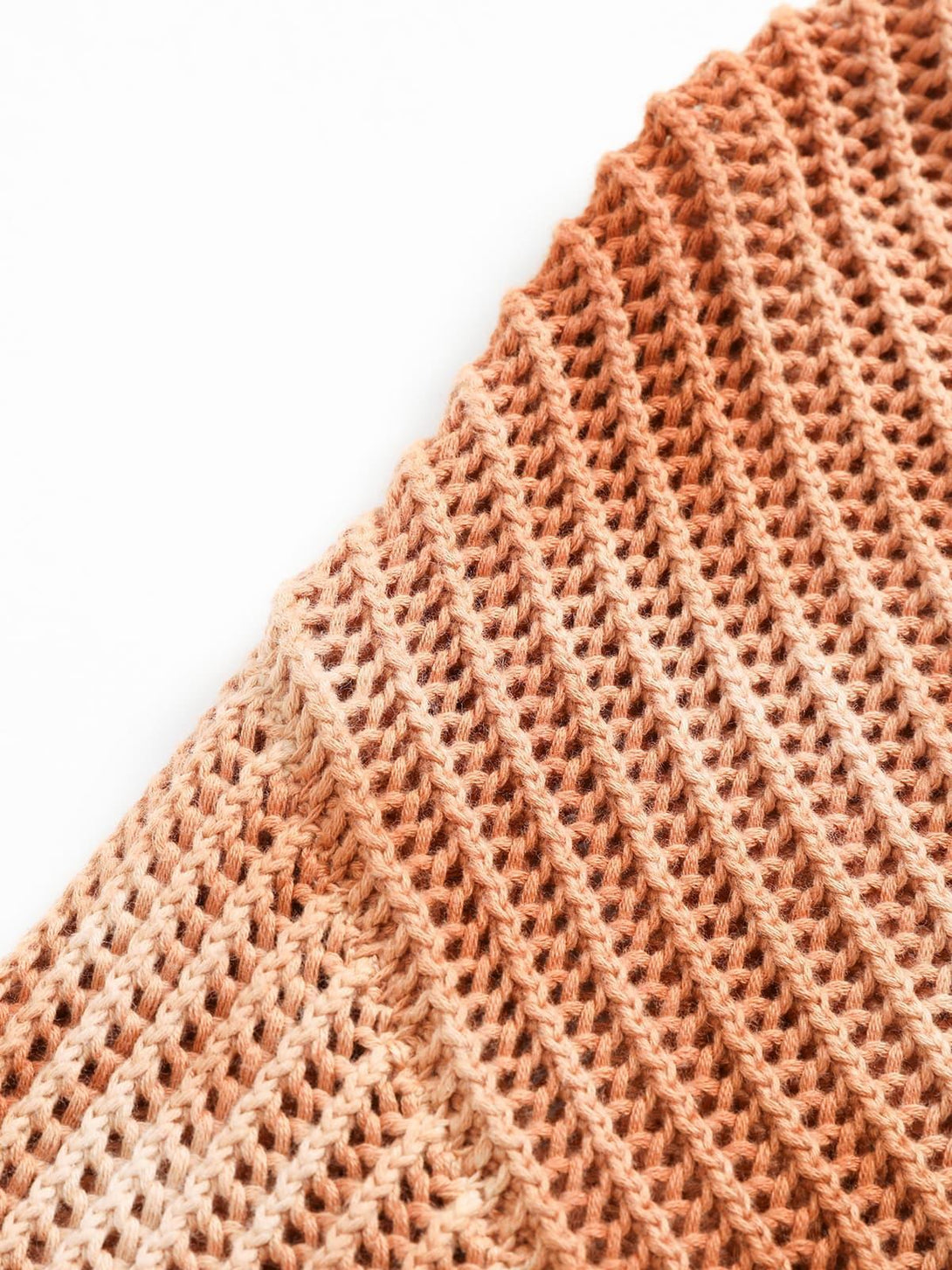 Intricate look at TALISHKO's gradient ombre knit sweater, highlighting the rich texture.
