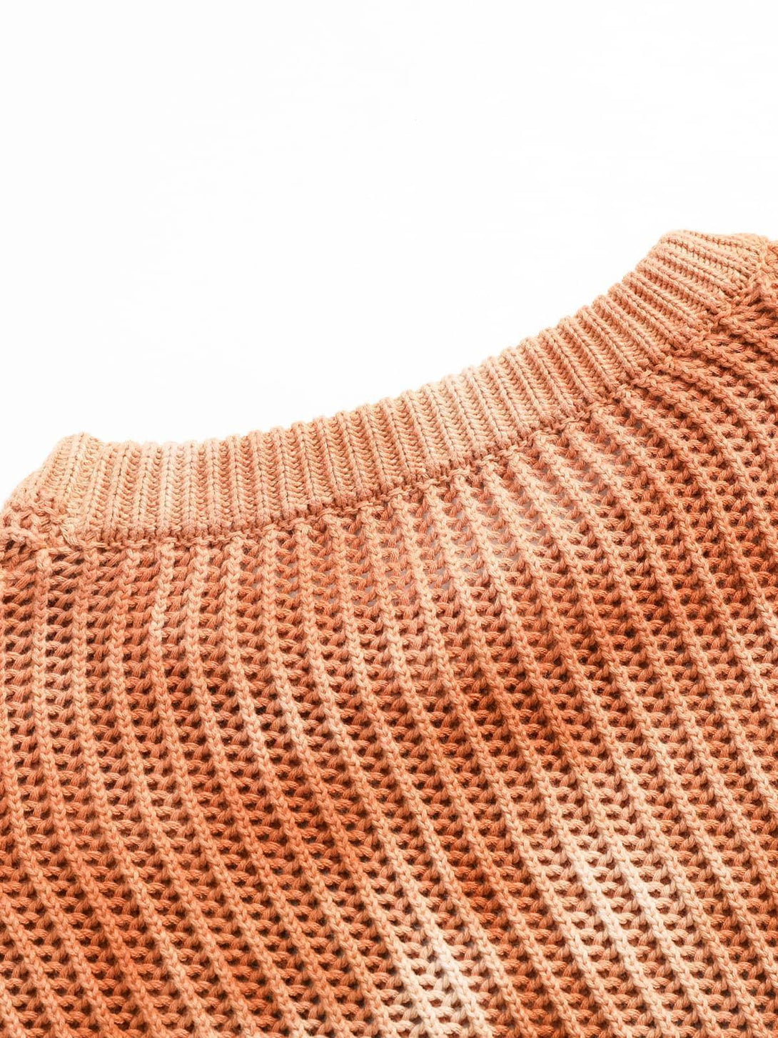 Zoomed-in texture of TALISHKO's gradient ombre knit sweater, showcasing intricate ribbing.