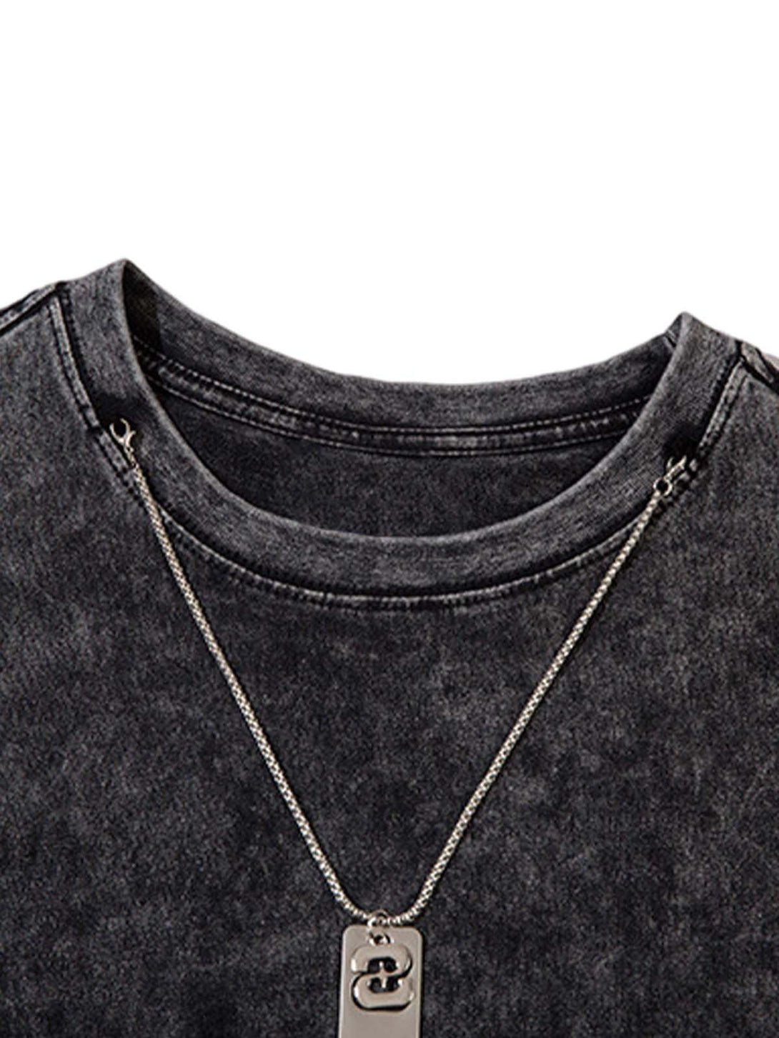 A detailed look at TALISHKO's black gradient tie-dye vest showing raw edges and casual style.