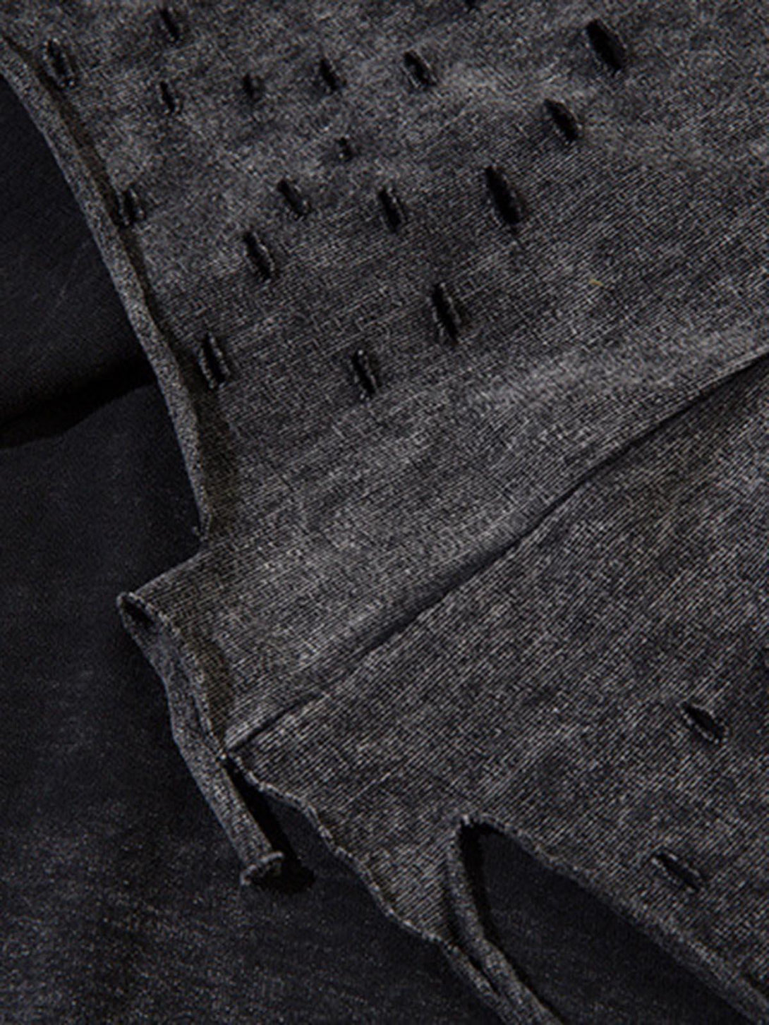Intricate look at TALISHKO's vest fabric, showcasing the raw edge and textured detailing.