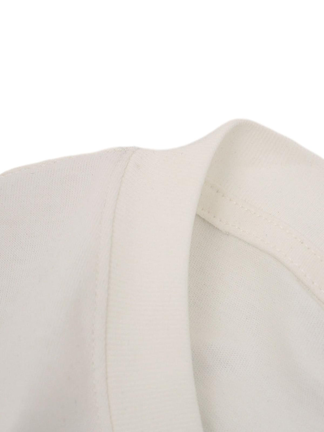 Detailed fabric and stitching of a TALISHKO T-shirt, emphasizing its clean, classic design.