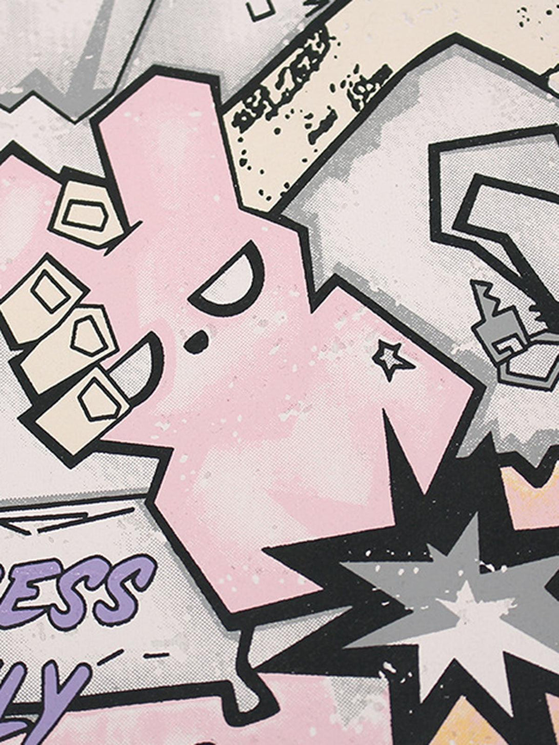 Playful graffiti art detail on a TALISHKO T-shirt, highlighting vibrant and edgy design elements.