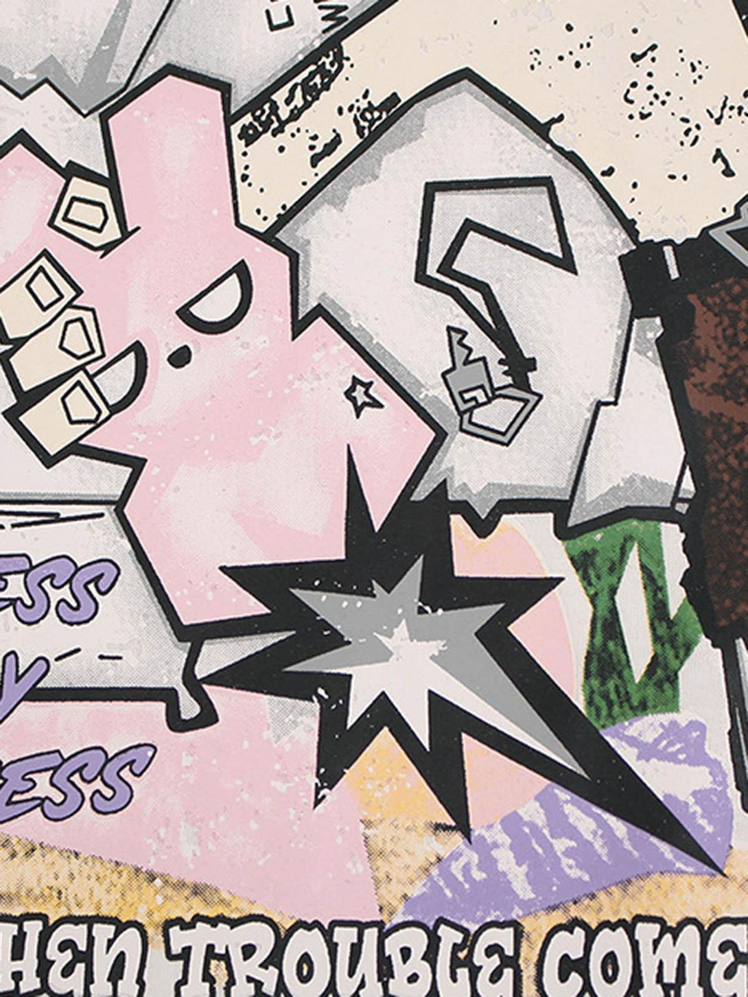 Graffiti-inspired design detail on a TALISHKO T-shirt, showcasing playful graphic elements.