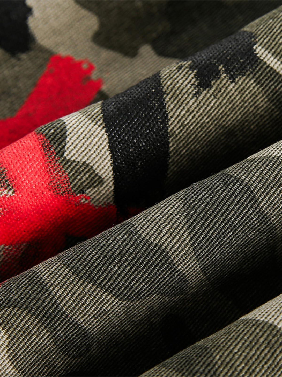 "Texture and pattern showcased on a TALISHKO graffiti camouflage bomber jacket, highlighting its unique design."